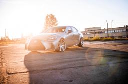 JR Wheels JR20 Silver alloy wheel mounted on car in an atmospheric setting