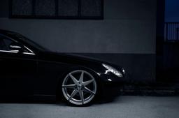 JR Wheels JR20 Silver alloy wheel mounted on car in an atmospheric setting