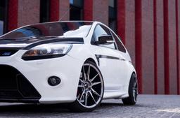 JR Wheels JR21 Grey alloy wheel mounted on car in an atmospheric setting