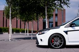 JR Wheels JR21 Grey alloy wheel mounted on car in an atmospheric setting