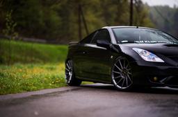 JR Wheels JR22 Grey alloy wheel mounted on car in an atmospheric setting