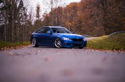 JR Wheels JR25 Silver alloy wheel mounted on car in an atmospheric setting