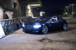 JR Wheels JR25 Silver alloy wheel mounted on car in an atmospheric setting