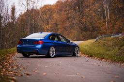 JR Wheels JR25 Silver alloy wheel mounted on car in an atmospheric setting