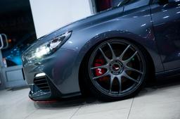 JR Wheels JR29 Grey alloy wheel mounted on car in an atmospheric setting
