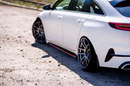 JR Wheels JR29 Grey alloy wheel mounted on car in an atmospheric setting