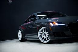 JR Wheels JR29 White alloy wheel mounted on car in an atmospheric setting