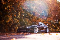 JR Wheels JR29 White alloy wheel mounted on car in an atmospheric setting