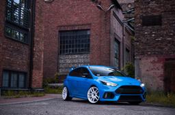 JR Wheels JR29 White alloy wheel mounted on car in an atmospheric setting