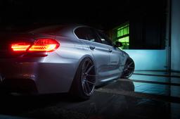 JR Wheels JR30 Grey alloy wheel mounted on car in an atmospheric setting