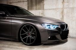 JR Wheels JR30 Grey alloy wheel mounted on car in an atmospheric setting