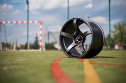 JR Wheels JR32 Grey alloy wheel mounted on car in an atmospheric setting