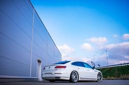 JR Wheels JR34 Silver alloy wheel mounted on car in an atmospheric setting