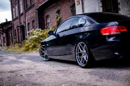 JR Wheels JR34 Grey alloy wheel mounted on car in an atmospheric setting