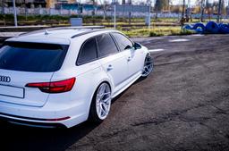 JR Wheels JR34 Silver alloy wheel mounted on car in an atmospheric setting