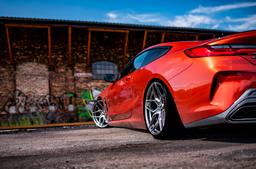 JR Wheels JR34 Grey alloy wheel mounted on car in an atmospheric setting