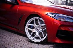 JR Wheels JR34 Silver alloy wheel mounted on car in an atmospheric setting