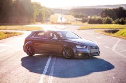 JR Wheels JR35 Grey alloy wheel mounted on car in an atmospheric setting