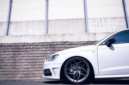 JR Wheels JR35 Grey alloy wheel mounted on car in an atmospheric setting