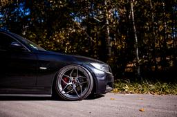 JR Wheels JR35 Grey alloy wheel mounted on car in an atmospheric setting