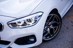 JR Wheels JR35 Grey alloy wheel mounted on car in an atmospheric setting