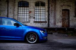 JR Wheels JR35 Grey alloy wheel mounted on car in an atmospheric setting