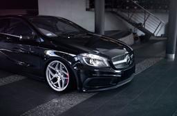 JR Wheels JR35 Silver alloy wheel mounted on car in an atmospheric setting