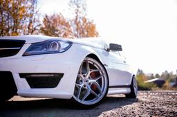 JR Wheels JR35 Silver alloy wheel mounted on car in an atmospheric setting