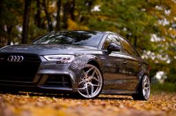 JR Wheels JR35 Silver alloy wheel mounted on car in an atmospheric setting