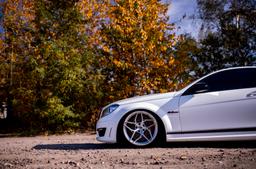 JR Wheels JR35 Silver alloy wheel mounted on car in an atmospheric setting