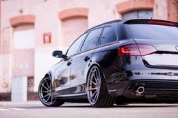 JR Wheels JR36 Grey alloy wheel mounted on car in an atmospheric setting