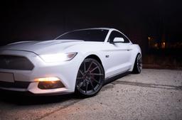 JR Wheels JR36 Grey alloy wheel mounted on car in an atmospheric setting