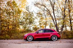 JR Wheels JR36 Silver alloy wheel mounted on car in an atmospheric setting
