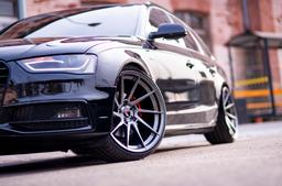 JR Wheels JR36 Grey alloy wheel mounted on car in an atmospheric setting