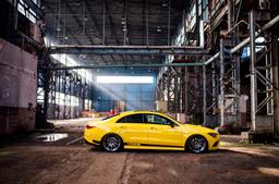 JR Wheels JR36 Grey alloy wheel mounted on car in an atmospheric setting