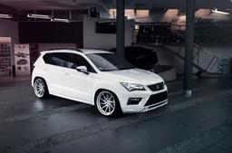 JR Wheels JR36 Silver alloy wheel mounted on car in an atmospheric setting