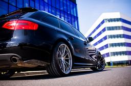 JR Wheels JR37 Grey alloy wheel mounted on car in an atmospheric setting