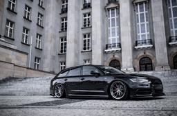 JR Wheels JR37 Grey alloy wheel mounted on car in an atmospheric setting