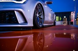 JR Wheels JR37 Grey alloy wheel mounted on car in an atmospheric setting