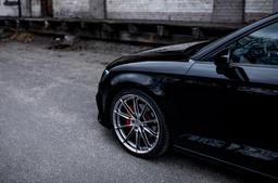 JR Wheels JR37 Grey alloy wheel mounted on car in an atmospheric setting