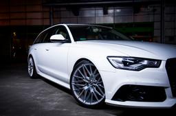 JR Wheels JR38 Silver alloy wheel mounted on car in an atmospheric setting