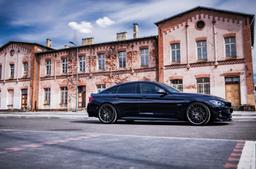 JR Wheels JR38 Grey alloy wheel mounted on car in an atmospheric setting