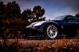 JR Wheels JR39 Silver alloy wheel mounted on car in an atmospheric setting
