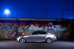 JR Wheels JR39 Silver alloy wheel mounted on car in an atmospheric setting