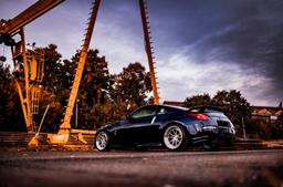 JR Wheels JR39 Silver alloy wheel mounted on car in an atmospheric setting