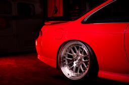 JR Wheels JR40 Silver alloy wheel mounted on car in an atmospheric setting