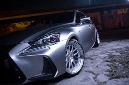 JR Wheels JR40 Silver alloy wheel mounted on car in an atmospheric setting