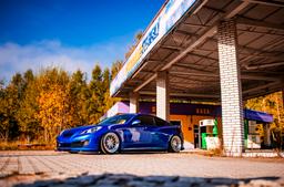 JR Wheels JR40 Silver alloy wheel mounted on car in an atmospheric setting