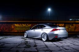 JR Wheels JR40 Silver alloy wheel mounted on car in an atmospheric setting