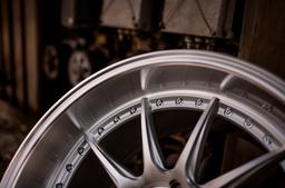 JR Wheels JR41 Silver alloy wheel mounted on car in an atmospheric setting